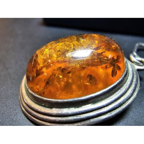203 - A large good quality 925 silver pair of amber earrings inset wit large natural Baltic amber cabochon... 