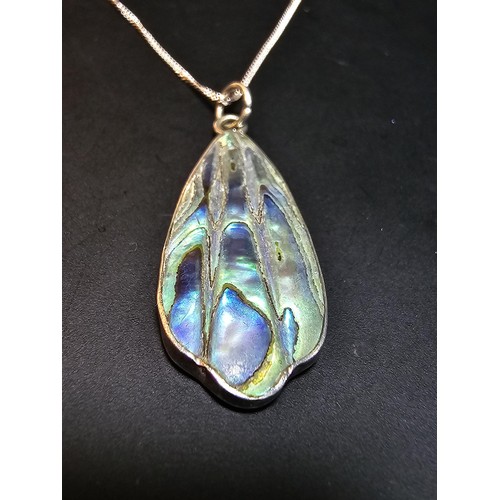 224 - A pretty 925 silver pendant inset with Abalone Shell presented in excellent flashing colours set on ... 
