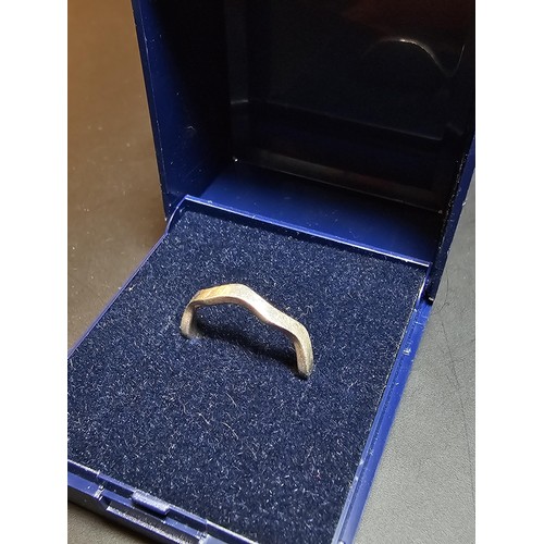 226 - A 925 silver ring with a wave design in excellent clean condition and boxed. Size I.5