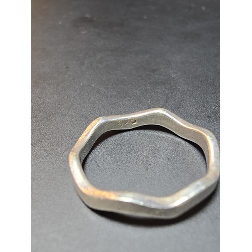226 - A 925 silver ring with a wave design in excellent clean condition and boxed. Size I.5