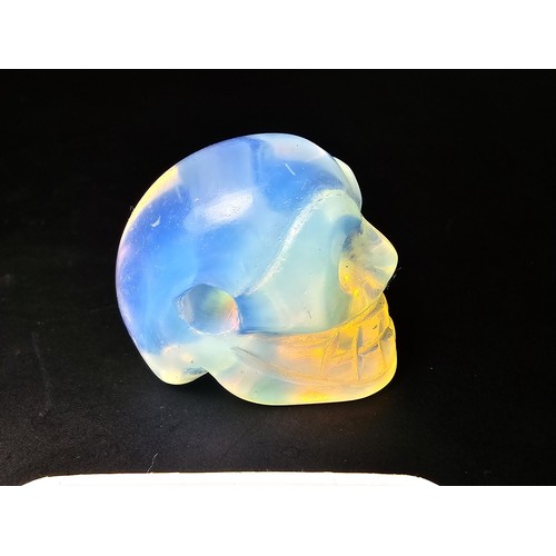 275 - 2x well carved opalite skull ornaments to include a blue opalite bird skull piece and a clear opalit... 