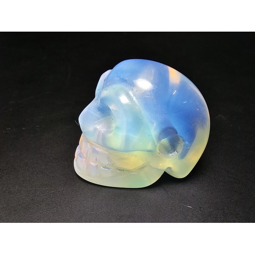 275 - 2x well carved opalite skull ornaments to include a blue opalite bird skull piece and a clear opalit... 