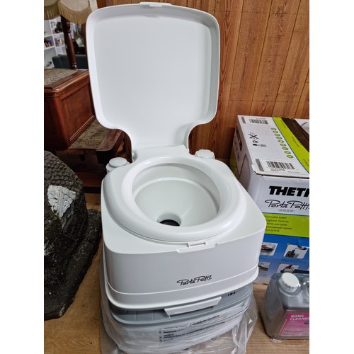 343A - An as new Thetford portapotti 165 ideal for caravens, etc. along with a new and sealed bottle of bow... 