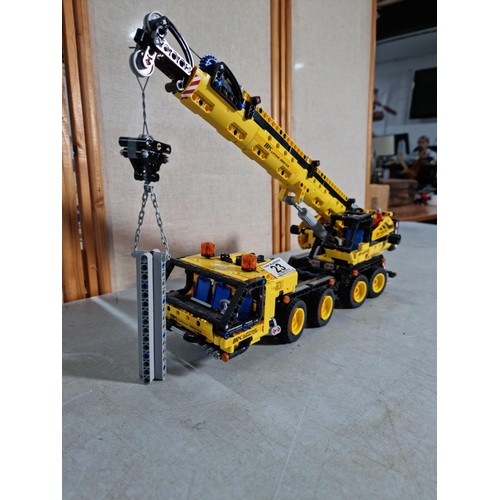 23 - Good quality well built Lego Technics GK 42108 mobile crane, with movable lifting arm, wind-up cord,... 