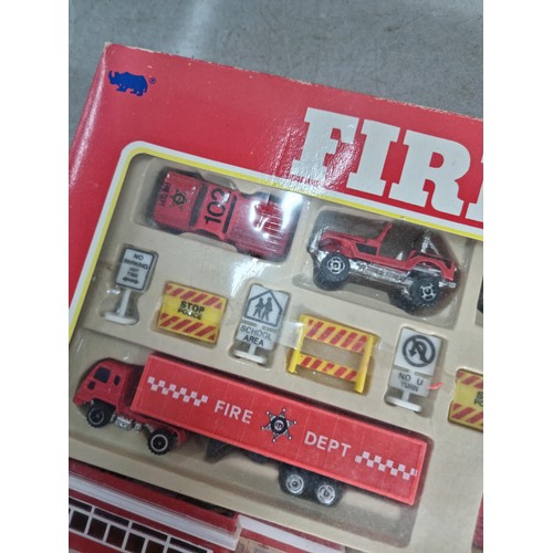 26 - A diecast model fire engine scene, vintage set, never been opened.