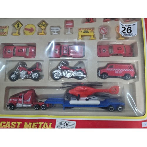 26 - A diecast model fire engine scene, vintage set, never been opened.