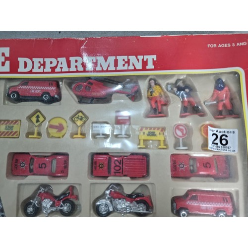 26 - A diecast model fire engine scene, vintage set, never been opened.