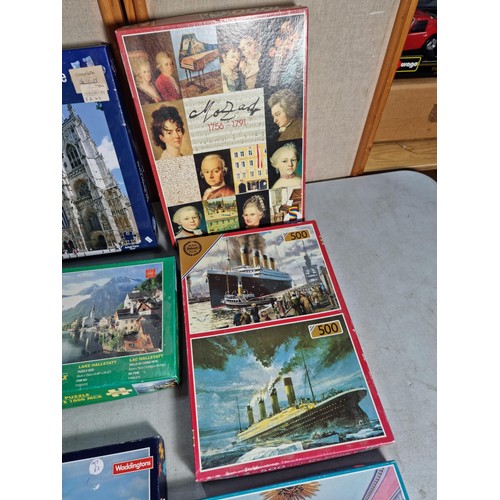 27 - A quantity of 9 jigsaw puzzles including a 1000 piece puzzle, see photos for subjects