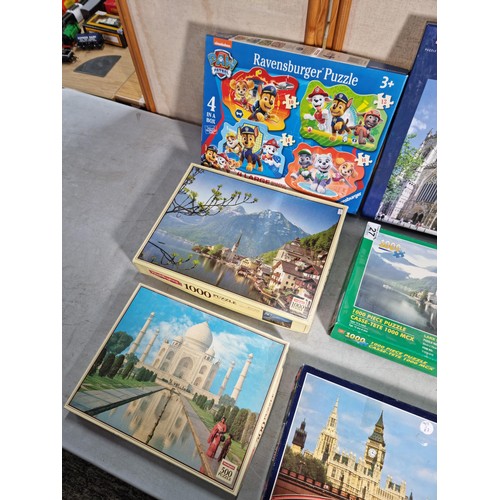 27 - A quantity of 9 jigsaw puzzles including a 1000 piece puzzle, see photos for subjects