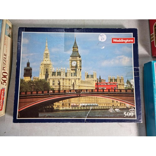 27 - A quantity of 9 jigsaw puzzles including a 1000 piece puzzle, see photos for subjects