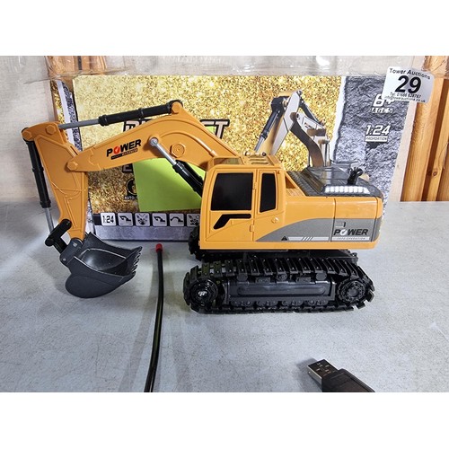 29 - A new in box diecast remote controlling excavator, complete with remote control.