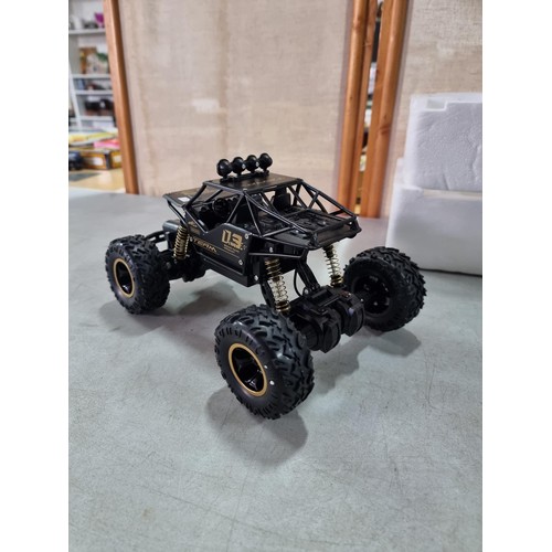 30 - A remote control buggy by Team Maxis 03, comes with polystyrene inner case.