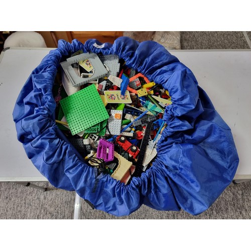 68 - Very large qty of mostly Lego and similar items complete in large blue soft bag with pull cord.