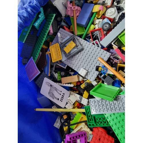 68 - Very large qty of mostly Lego and similar items complete in large blue soft bag with pull cord.