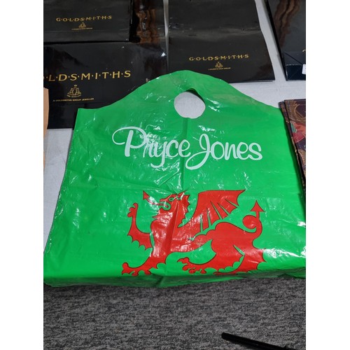 119 - Collection of collectable carrier bags to include one by Pryce Jones, Spar, Goldsmiths Group Jewelle... 