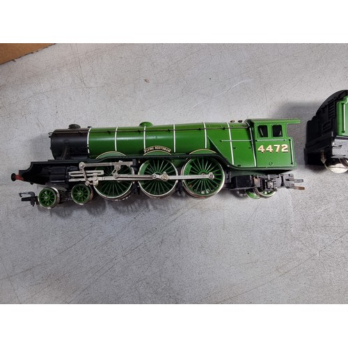 31 - Hornby R2261 Flying Scotsman LNER 4472 Locomotive and Corridor Tender with three matching LNER Teak ... 