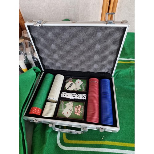 434A - A metal cased complete poker set with chips, lockable with its key along with a revolving poker chip... 