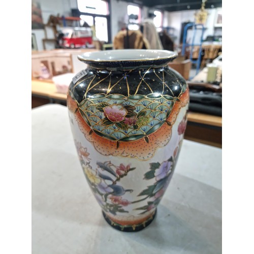 23 - Pair of tall hand decorated ceramic vases with floral design both in good order with no chips or cra... 