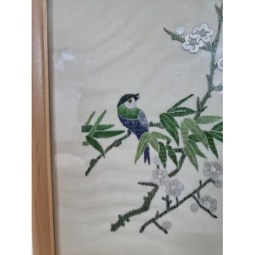 25 - Framed & glazed antique oriental silk hand embroidered of a bird on a Prunus tree, hand signed, heig... 