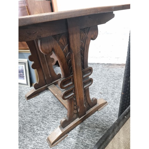 30 - Good quality refectory table in oak with ornate carved legs in the style of a plume of feathers, in ... 