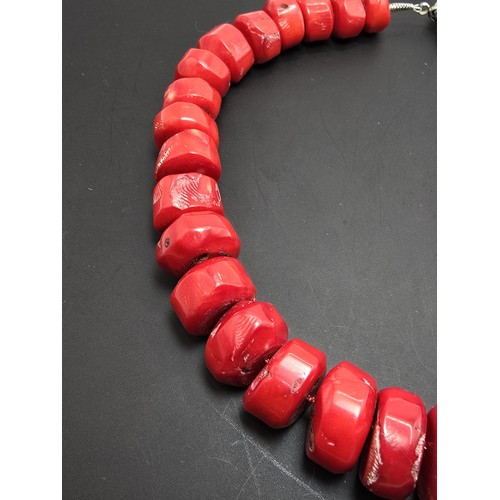 269 - A large and impressive natural red coral beaded necklace having a good weight and presenting an exce... 