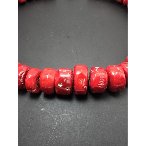 269 - A large and impressive natural red coral beaded necklace having a good weight and presenting an exce... 