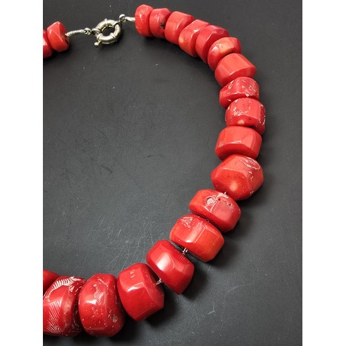 269 - A large and impressive natural red coral beaded necklace having a good weight and presenting an exce... 