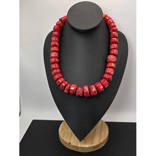 269 - A large and impressive natural red coral beaded necklace having a good weight and presenting an exce... 