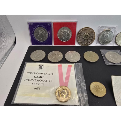 269A - A collection of various British coins which includes 2x one pound notes, 2x two pound coins, a Five ... 