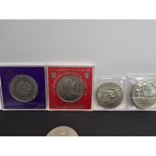 269A - A collection of various British coins which includes 2x one pound notes, 2x two pound coins, a Five ... 