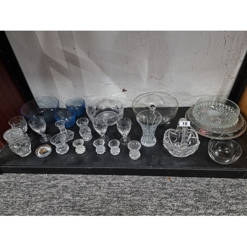 18 - Shelf containing a large quantity of cut glass crystal glassware inc crystal cut vases, blue glass s... 