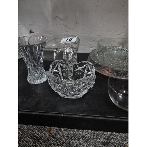 18 - Shelf containing a large quantity of cut glass crystal glassware inc crystal cut vases, blue glass s... 