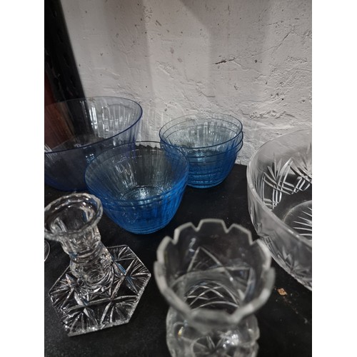 18 - Shelf containing a large quantity of cut glass crystal glassware inc crystal cut vases, blue glass s... 