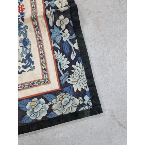 29 - Good quality antique silk wall hanger with oriental scene and blue flower border in good order with ... 