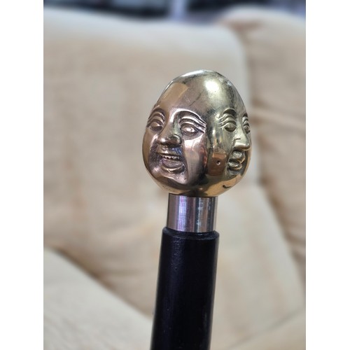 47 - A Good quality brass Buddha topped walking stick with 4 different expressions to each side (4 noble ... 