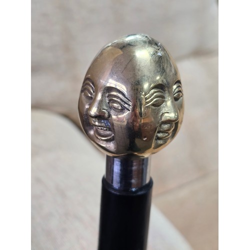 47 - A Good quality brass Buddha topped walking stick with 4 different expressions to each side (4 noble ... 