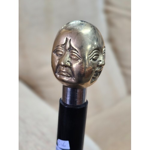 47 - A Good quality brass Buddha topped walking stick with 4 different expressions to each side (4 noble ... 