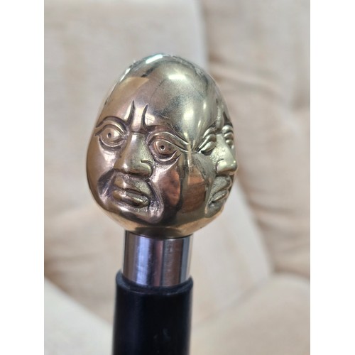 47 - A Good quality brass Buddha topped walking stick with 4 different expressions to each side (4 noble ... 