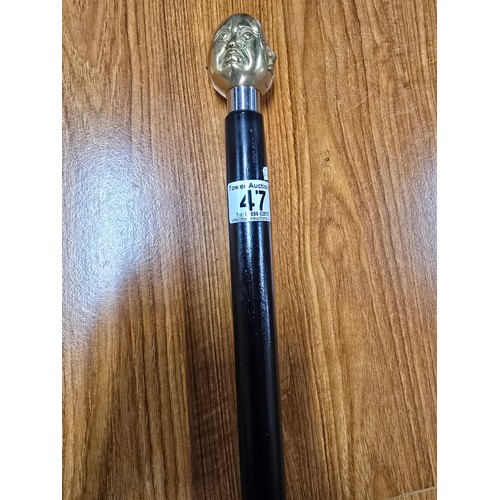 47 - A Good quality brass Buddha topped walking stick with 4 different expressions to each side (4 noble ... 