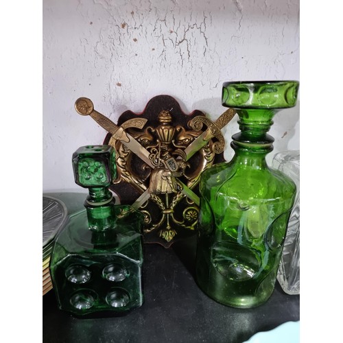 16A - A shelf full of collectables including 3 decanters, 1 in a diced design, a sundae dish set, a salt a... 