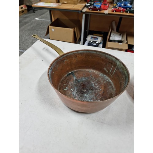 8 - A quantity of antique kitchenalia including a large heavy duty copper pan with brass handle along wi... 