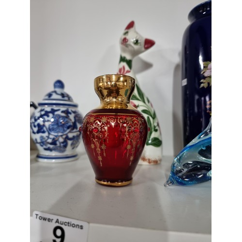 9 - A shelf full of collectables including a good quality handmade art crystal seal by l'ne studio Swede... 