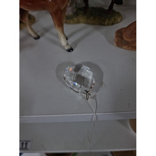 9 - A shelf full of collectables including a good quality handmade art crystal seal by l'ne studio Swede... 