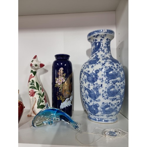 9 - A shelf full of collectables including a good quality handmade art crystal seal by l'ne studio Swede... 