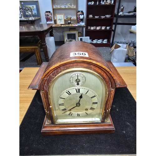 46 - A good quality antique oak mantel clock featuring an 8 day movement striking with a ting tang double... 