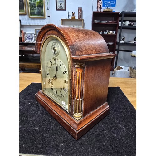 46 - A good quality antique oak mantel clock featuring an 8 day movement striking with a ting tang double... 