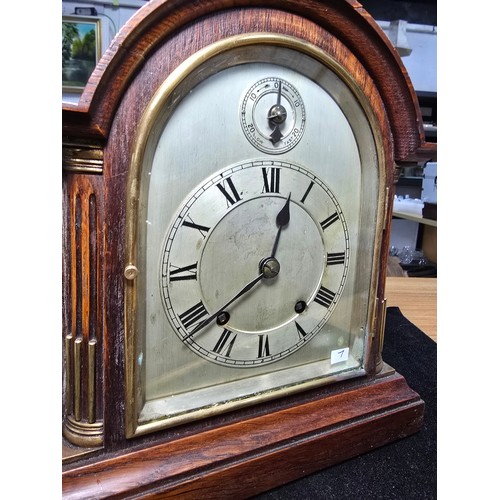 46 - A good quality antique oak mantel clock featuring an 8 day movement striking with a ting tang double... 