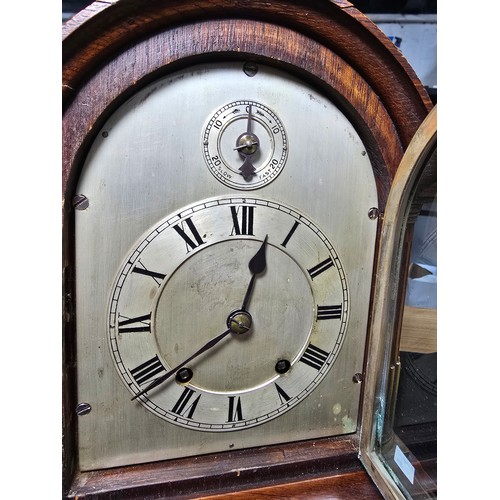 46 - A good quality antique oak mantel clock featuring an 8 day movement striking with a ting tang double... 