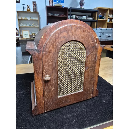 46 - A good quality antique oak mantel clock featuring an 8 day movement striking with a ting tang double... 