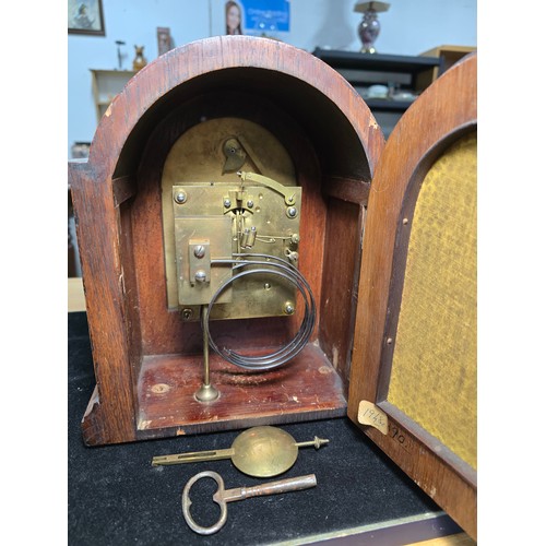 46 - A good quality antique oak mantel clock featuring an 8 day movement striking with a ting tang double... 
